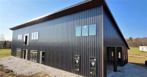 black metal building house|black barndominium with wood accents.